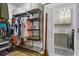 Well-organized closet with custom shelving and storage solutions, adjoining laundry room at 2013 White Cypress Ct, Smyrna, GA 30082
