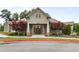 Attractive community clubhouse featuring symmetrical design, double door entry, and complemented by mature landscaping at 2013 White Cypress Ct, Smyrna, GA 30082