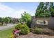 Welcome to Smyrna Grove, a community featuring a stone entrance, manicured landscaping, and inviting neighborhood street at 2013 White Cypress Ct, Smyrna, GA 30082