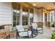 Inviting front porch with stone accents, comfortable seating, and stylish lighting, perfect for relaxing outdoors at 2013 White Cypress Ct, Smyrna, GA 30082