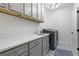 Spacious laundry room featuring modern appliances, cabinetry, and ample counter space at 2013 White Cypress Ct, Smyrna, GA 30082