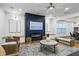 Open-concept living area with hardwood floors, a modern fireplace, and a seamless transition to the dining area at 2013 White Cypress Ct, Smyrna, GA 30082