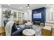Inviting living room with a navy accent wall, fireplace, modern decor, and ample seating for gatherings at 2013 White Cypress Ct, Smyrna, GA 30082