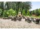Picturesque outdoor fireplace area with grilling stations and comfortable seating, perfect for social gatherings at 2013 White Cypress Ct, Smyrna, GA 30082