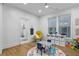 Bright playroom features an alphabet rug, play table, chair, toy storage, and hardwood floors at 2013 White Cypress Ct, Smyrna, GA 30082