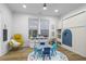 Bright playroom features an alphabet rug, play table, chair, toy storage, and hardwood floors at 2013 White Cypress Ct, Smyrna, GA 30082