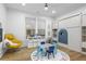 Bright playroom features an alphabet rug, play table, chair, toy storage, and hardwood floors at 2013 White Cypress Ct, Smyrna, GA 30082