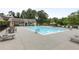 Enjoy the community pool with lounge chairs, tables, and umbrellas, offering a relaxing outdoor experience for residents at 2013 White Cypress Ct, Smyrna, GA 30082