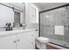 Modern bathroom boasts a glass shower, vanity with a mirror, and updated fixtures at 214 Chelsea Ct, Woodstock, GA 30189