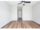 Empty bedroom with a ceiling fan and plank floors at 214 Chelsea Ct, Woodstock, GA 30189