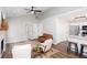 A bright living room featuring a fireplace, neutral colors, and an open floor plan at 214 Chelsea Ct, Woodstock, GA 30189