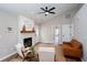 Living room view with fireplace, neutral colors, and entryway at 214 Chelsea Ct, Woodstock, GA 30189