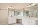 Bright bathroom featuring a double sink with white marble countertops and a large mirror at 1713 Paramore Ne, Marietta, GA 30062