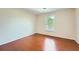 Empty room featuring a hardwood floor and large windows at 1713 Paramore Ne, Marietta, GA 30062