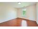 Empty room featuring a hardwood floor and large windows at 1713 Paramore Ne, Marietta, GA 30062