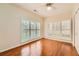 Bedroom with hardwood floors, large windows, and plantation shutters, allowing for ample natural light at 1713 Paramore Ne, Marietta, GA 30062
