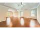 Large bonus room with hardwood flooring, tray ceiling, large windows, and neutral color scheme at 1713 Paramore Ne, Marietta, GA 30062
