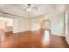 Large bonus room with hardwood flooring, tray ceiling, large windows, and neutral color scheme at 1713 Paramore Ne, Marietta, GA 30062
