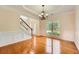 Dining room showcasing beautiful hardwood floors, large windows and a decorative chandelier at 1713 Paramore Ne, Marietta, GA 30062