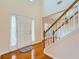 Welcoming entryway featuring a high ceiling, white door with sidelights, and beautiful hardwood flooring at 1713 Paramore Ne, Marietta, GA 30062