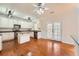 Bright kitchen with white cabinetry, granite countertops, stainless steel appliances, and hardwood floors at 1713 Paramore Ne, Marietta, GA 30062