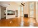 Open-concept living room with hardwood floors, fireplace, and kitchen view at 1713 Paramore Ne, Marietta, GA 30062
