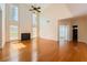 Spacious living room with a fireplace, tall windows, and beautiful hardwood flooring at 1713 Paramore Ne, Marietta, GA 30062