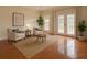 Bright sunroom with neutral walls, tile flooring, and French doors, complemented by stylish furniture at 1713 Paramore Ne, Marietta, GA 30062