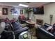 Entertainment space with comfortable seating, a mounted TV, and a cozy fireplace at 2050 Lyda Ln, Loganville, GA 30052