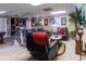 Finished basement with a wet bar, a comfortable sitting area, and sports-themed decor at 2050 Lyda Ln, Loganville, GA 30052