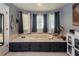 Relaxing bathroom with a large soaking tub, tiled surround, and soft window lighting at 2050 Lyda Ln, Loganville, GA 30052