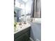 Cozy bathroom featuring a vessel sink, decorative mirror, and gray color scheme at 2050 Lyda Ln, Loganville, GA 30052