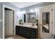 Bright bathroom with dual sinks, ample counter space, and updated lighting fixtures at 2050 Lyda Ln, Loganville, GA 30052