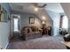Cozy carpeted bedroom featuring a charming sitting area and a unique angled ceiling at 2050 Lyda Ln, Loganville, GA 30052