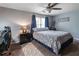 Cozy bedroom with a queen bed, soft lighting, and neutral décor at 2050 Lyda Ln, Loganville, GA 30052