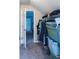 Organized walk-in closet with ample storage space and visible access to another bedroom at 2050 Lyda Ln, Loganville, GA 30052