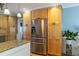 Bright kitchen featuring stainless steel appliances, natural wood cabinets, and granite countertops at 2050 Lyda Ln, Loganville, GA 30052