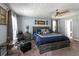 Spacious main bedroom with a king bed, plush carpet, and calming blue decor at 2050 Lyda Ln, Loganville, GA 30052