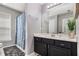 This is a bathroom with a shower, a sink, and a mirror at 3533 Aberdeen Way, Douglasville, GA 30135