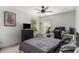 This is a bedroom with a ceiling fan, a desk, and a large window at 3533 Aberdeen Way, Douglasville, GA 30135