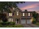 Charming two-story home with a stone facade, a two-car garage, and professionally landscaped front yard at 3533 Aberdeen Way, Douglasville, GA 30135