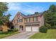 Beautiful two-story home featuring a stone and siding facade, a two-car garage, and a well-manicured lawn at 3533 Aberdeen Way, Douglasville, GA 30135