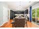 Eat-in kitchen with dark cabinetry, stainless steel appliances, and a sliding glass door to the backyard at 3533 Aberdeen Way, Douglasville, GA 30135