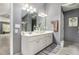 Stylish main bathroom with double sink vanity, white cabinets, and tiled floors at 3533 Aberdeen Way, Douglasville, GA 30135