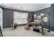 Comfortable office space with a large window, neutral carpet, and gray walls at 3533 Aberdeen Way, Douglasville, GA 30135