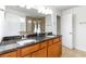 Bathroom featuring double sinks, granite countertops, and tile floors at 441 Spring View Dr, Woodstock, GA 30188