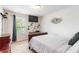 Bedroom with large bed, modern decor, neutral walls, and large window with natural light at 441 Spring View Dr, Woodstock, GA 30188