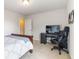 Bedroom featuring large bed, desk with TV, and comfortable chair with neutral walls at 441 Spring View Dr, Woodstock, GA 30188