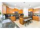 Kitchen boasts stainless steel appliances, granite countertops, and a center island with seating at 441 Spring View Dr, Woodstock, GA 30188