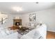 Spacious living room featuring a stone fireplace, hardwood floors, and neutral decor at 441 Spring View Dr, Woodstock, GA 30188